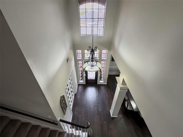 2202 Canterbury Ct, Deer Park, TX 77536 - foyer with a towering ceiling, stairs, dark wood-type flooring, and a chandelier