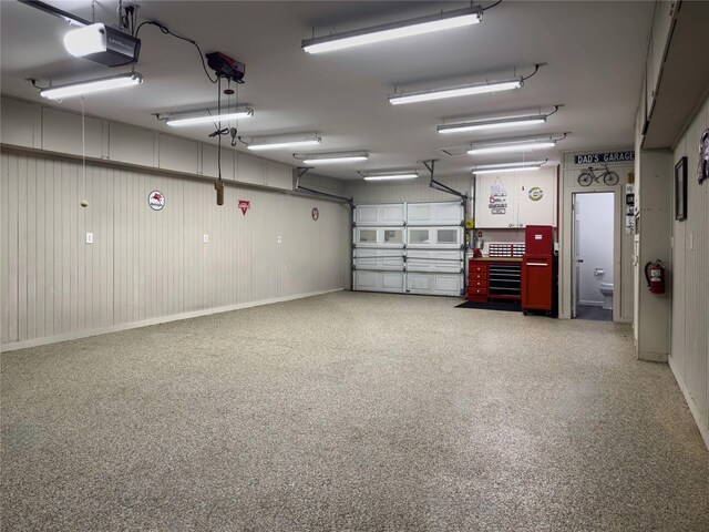 2202 Canterbury Ct, Deer Park, TX 77536 - garage featuring a garage door opener and baseboards