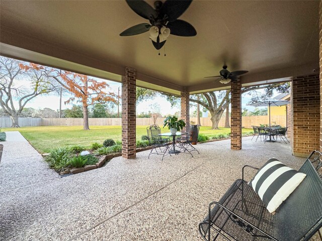 2202 Canterbury Ct, Deer Park, TX 77536 - view of patio with outdoor dining space and a ceiling fan