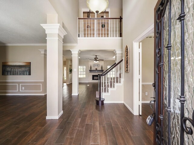 2202 Canterbury Ct, Deer Park, TX 77536 - foyer featuring wood finished floors, ceiling fan, stairway, baseboards, and crown molding