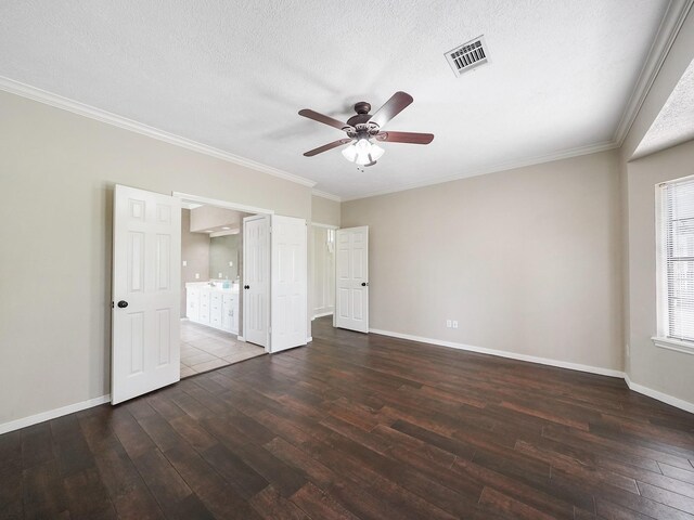 2202 Canterbury Ct, Deer Park, TX 77536 - unfurnished bedroom with hardwood / wood-style floors, baseboards, ornamental molding, connected bathroom, and a textured ceiling