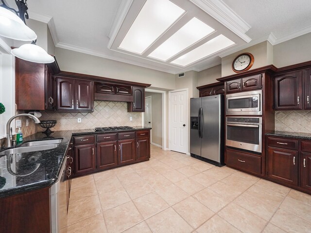 2202 Canterbury Ct, Deer Park, TX 77536 - kitchen with stainless steel appliances, a sink, backsplash, light tile patterned floors, and dark brown cabinetry