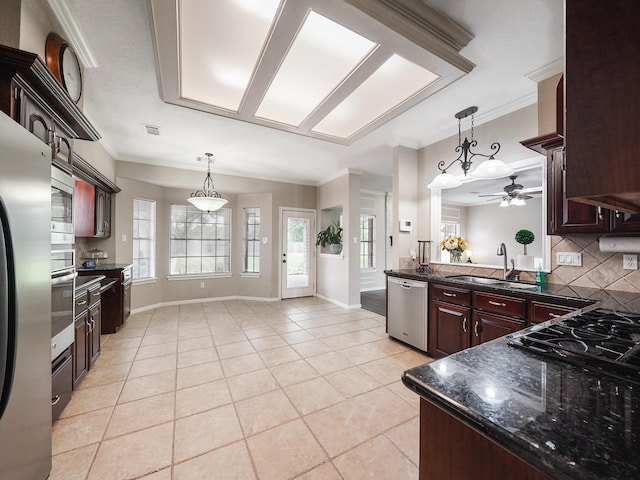 2202 Canterbury Ct, Deer Park, TX 77536 - kitchen featuring appliances with stainless steel finishes, a sink, a ceiling fan, decorative backsplash, and light tile patterned floors