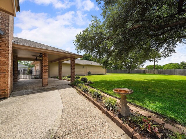 2202 Canterbury Ct, Deer Park, TX 77536 - view of yard featuring ceiling fan and a patio area