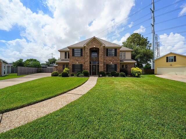 2202 Canterbury Ct, Deer Park, TX 77536 - view of front facade featuring brick siding, concrete driveway, and a shingled roof