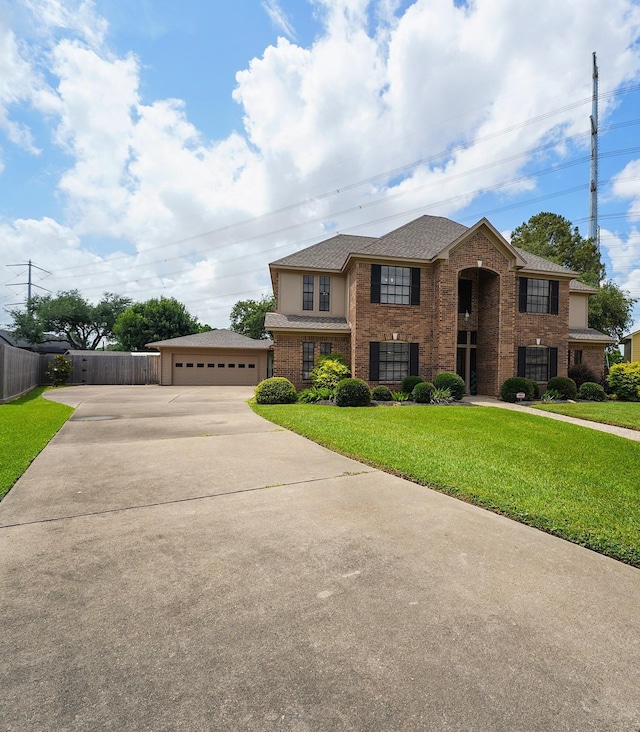 2202 Canterbury Ct, Deer Park, TX 77536 - traditional home featuring brick siding, a garage, driveway, and a shingled roof