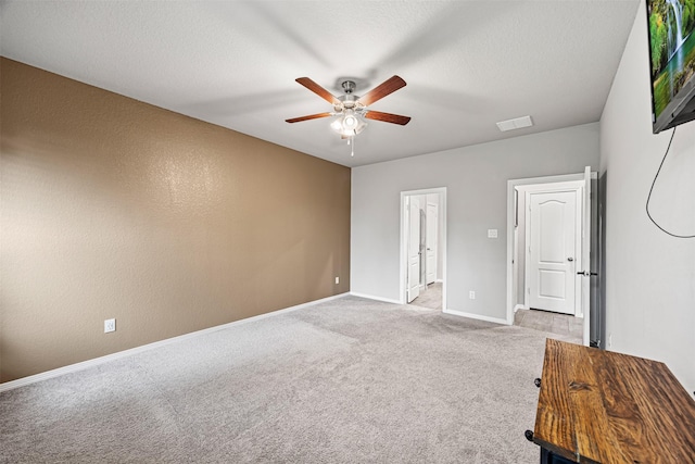 24818 Russet Bluff Trl, Houston, TX 77336 - interior space with light carpet, a textured ceiling, baseboards, visible vents, and ceiling fan