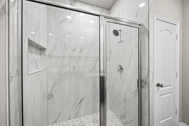 24818 Russet Bluff Trl, Houston, TX 77336 - bathroom with a textured wall and a marble finish shower