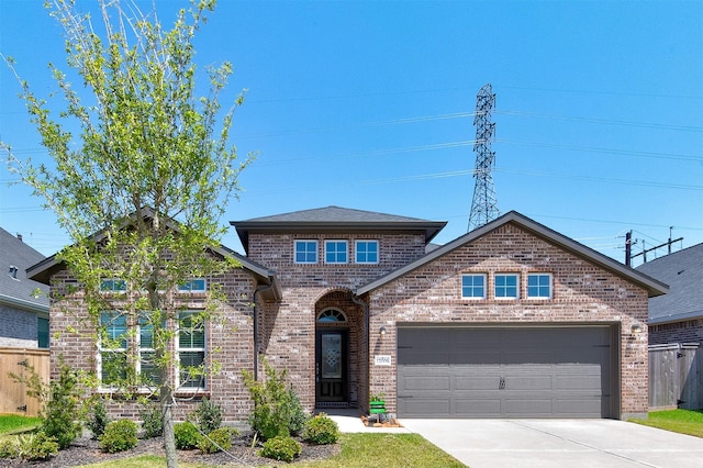 12006 Wooden Mill Ln, Santa Fe, TX 77510 - view of front of property featuring brick siding, driveway, and an attached garage