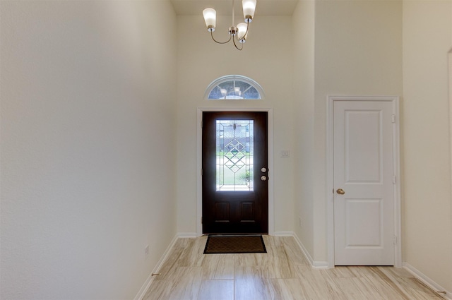 12006 Wooden Mill Ln, Santa Fe, TX 77510 - foyer entrance with a chandelier and baseboards