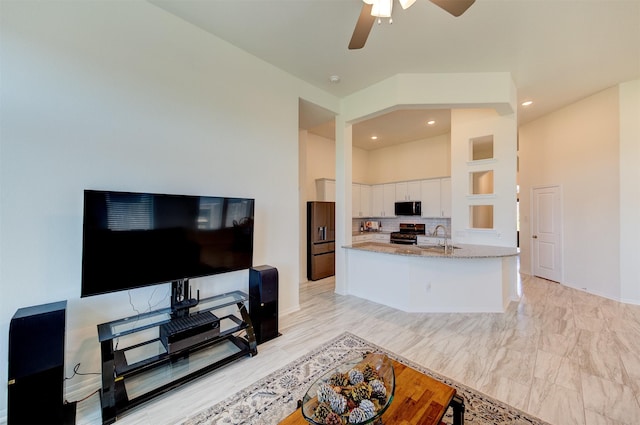 12006 Wooden Mill Ln, Santa Fe, TX 77510 - living room featuring ceiling fan, baseboards, and recessed lighting