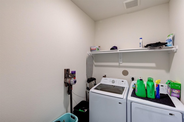 12006 Wooden Mill Ln, Santa Fe, TX 77510 - laundry room featuring visible vents, independent washer and dryer, and laundry area