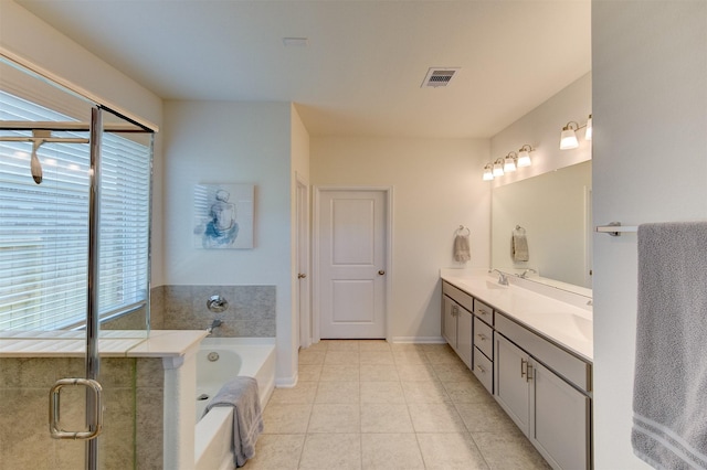 12006 Wooden Mill Ln, Santa Fe, TX 77510 - full bath featuring double vanity, tile patterned floors, a bath, visible vents, and a sink