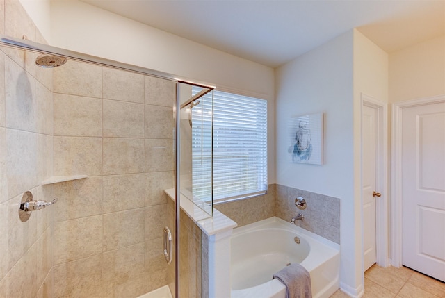 12006 Wooden Mill Ln, Santa Fe, TX 77510 - bathroom featuring a shower stall, a garden tub, and tile patterned flooring