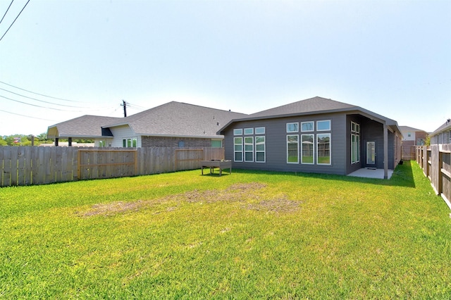12006 Wooden Mill Ln, Santa Fe, TX 77510 - rear view of property with a fenced backyard and a lawn