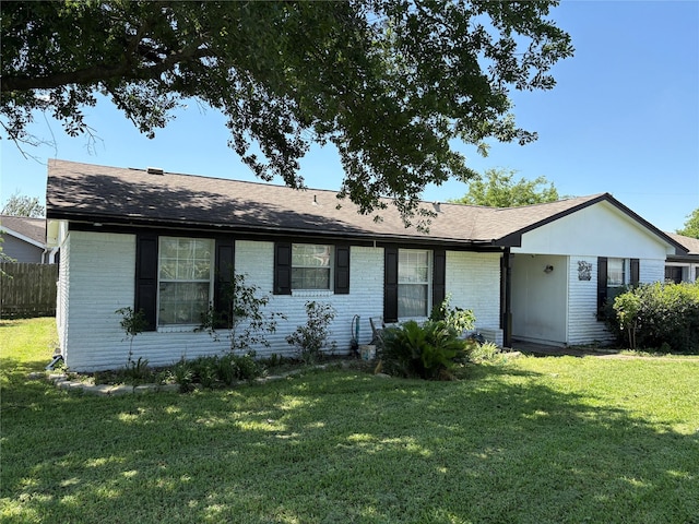 431 Crockett St, Channelview, TX 77530 - view of front facade with brick siding, a front lawn, and fence