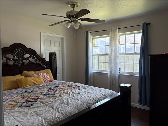 431 Crockett St, Channelview, TX 77530 - bedroom featuring baseboards, a ceiling fan, and wood finished floors