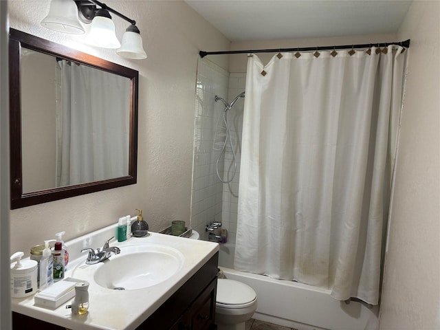 431 Crockett St, Channelview, TX 77530 - full bathroom featuring toilet, shower / bathtub combination with curtain, vanity, and a textured wall