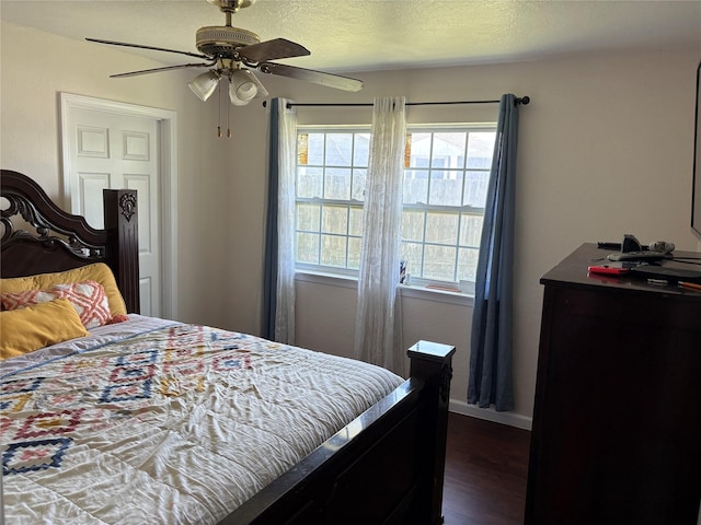 431 Crockett St, Channelview, TX 77530 - bedroom featuring dark wood finished floors, ceiling fan, baseboards, and multiple windows