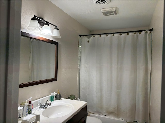 431 Crockett St, Channelview, TX 77530 - bathroom featuring toilet, shower / bathtub combination with curtain, vanity, and visible vents