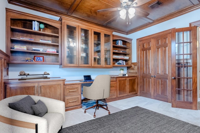 carpeted office with built in study area, ceiling fan, ornamental molding, and wood ceiling
