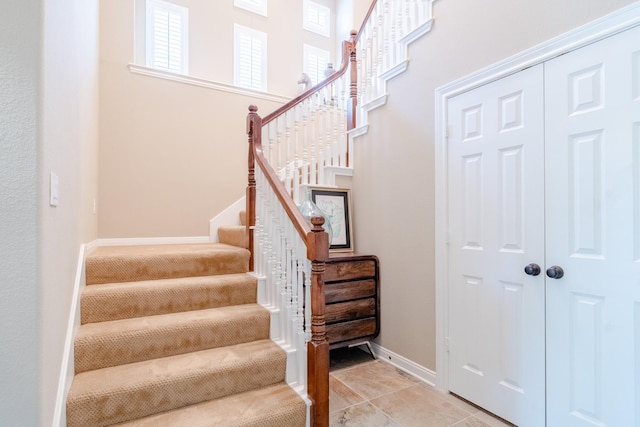 stairway featuring baseboards