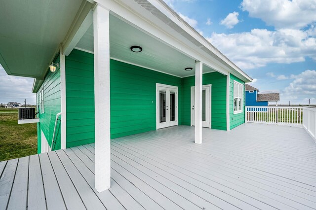 4014 Mitote Dr, Galveston, TX 77554 - wooden terrace with french doors