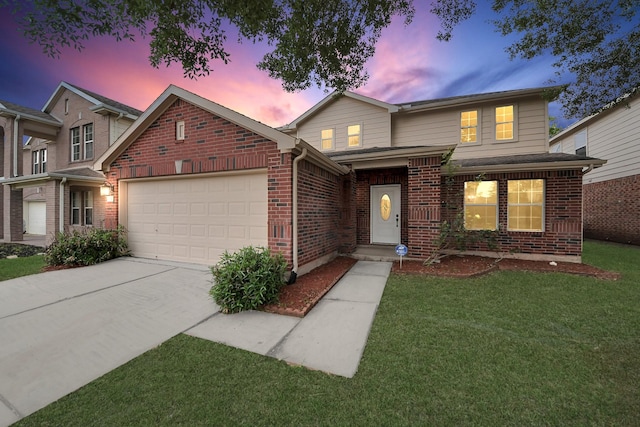traditional-style house with driveway, brick siding, a garage, and a yard