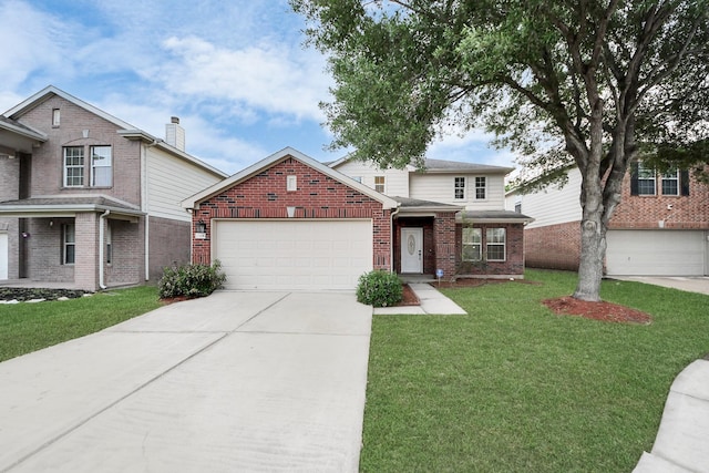traditional home featuring a front lawn, driveway, an attached garage, and brick siding