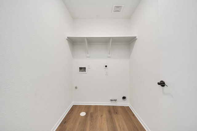 clothes washing area featuring hookup for an electric dryer, gas dryer hookup, visible vents, laundry area, and washer hookup