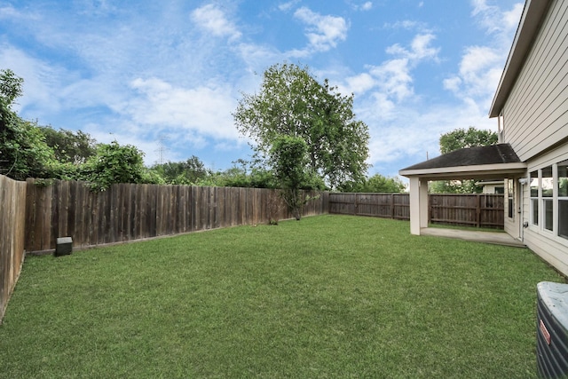 view of yard with a fenced backyard
