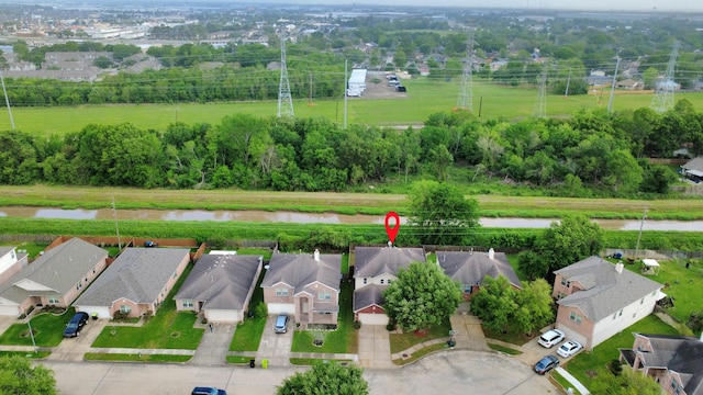 aerial view featuring a residential view and a water view
