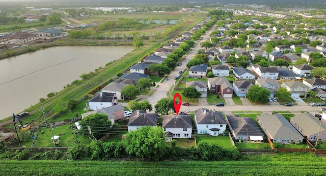 birds eye view of property featuring a residential view and a water view