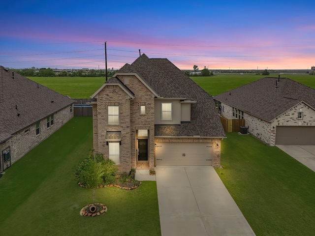 14031 Little River Dr, Baytown, TX 77523 - traditional home featuring brick siding, concrete driveway, a garage, and roof with shingles