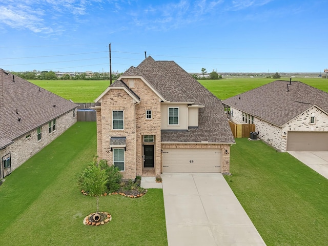 14031 Little River Dr, Baytown, TX 77523 - traditional home with brick siding, roof with shingles, driveway, and a garage