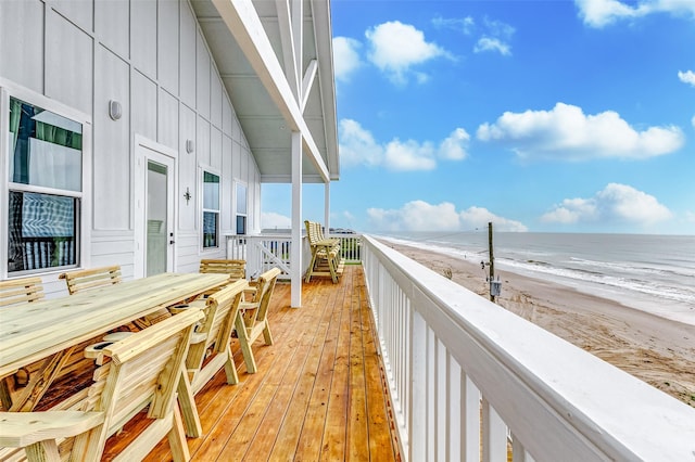 exterior space featuring a beach view and a water view