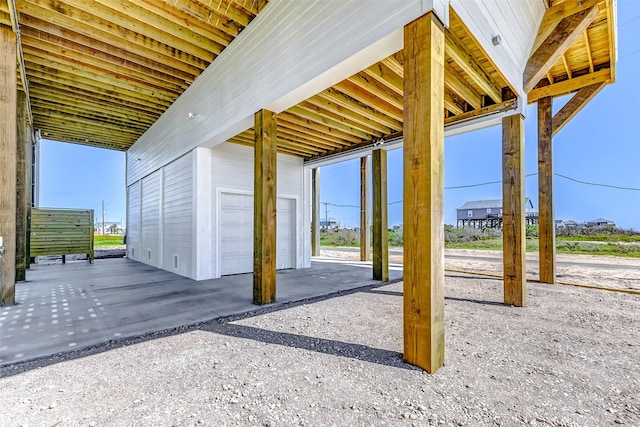 view of patio featuring a garage
