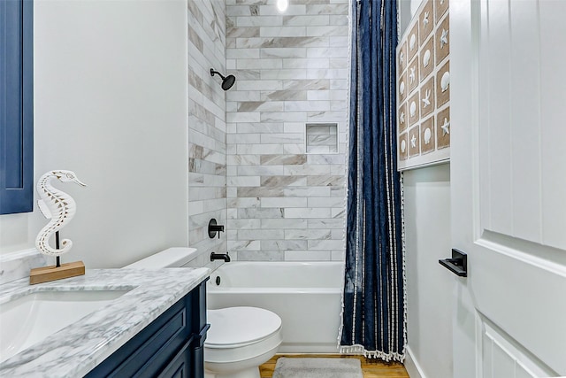 full bath with toilet, vanity, and shower / bath combination with curtain