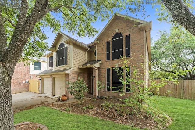 1307 Sandpiper Ct S, Pearland, TX 77584 - traditional home with fence, a front lawn, brick siding, an attached garage, and driveway