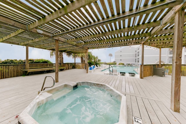 7600 Seawall Blvd Unit 214, Galveston, TX 77551 - community pool with a deck and a pergola