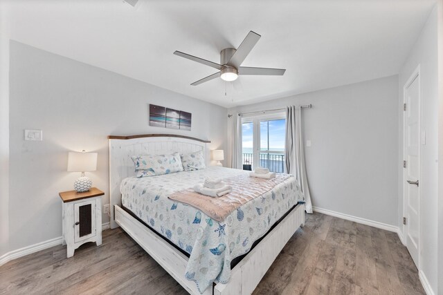 7600 Seawall Blvd Unit 214, Galveston, TX 77551 - bedroom with wood finished floors, access to outside, and ceiling fan