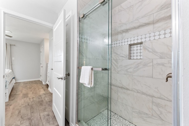 7600 Seawall Blvd Unit 214, Galveston, TX 77551 - full bathroom with a stall shower and wood finished floors