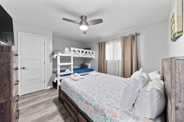 7600 Seawall Blvd Unit 214, Galveston, TX 77551 - bedroom with wood finished floors and a ceiling fan