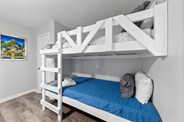 7600 Seawall Blvd Unit 214, Galveston, TX 77551 - bedroom featuring wood finished floors and baseboards