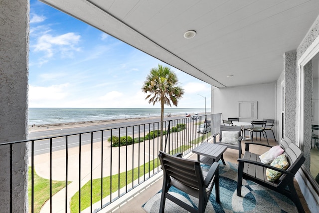 7600 Seawall Blvd Unit 214, Galveston, TX 77551 - balcony featuring view of water and beach