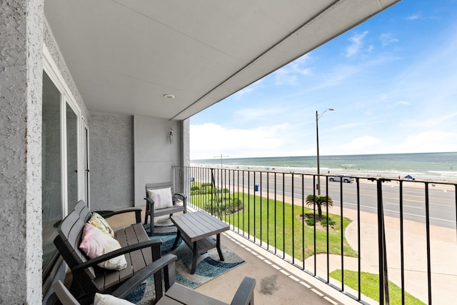 7600 Seawall Blvd Unit 214, Galveston, TX 77551 - balcony featuring view of water and beach