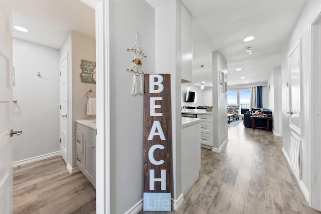 7600 Seawall Blvd Unit 214, Galveston, TX 77551 - corridor with light wood-style floors and recessed lighting