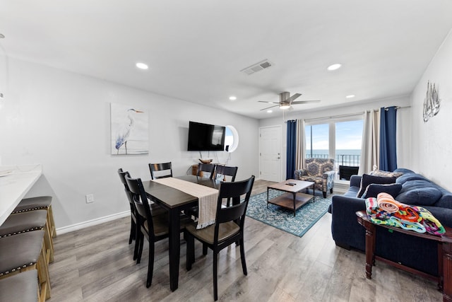 7600 Seawall Blvd Unit 214, Galveston, TX 77551 - dining room with light wood finished floors, a ceiling fan, and recessed lighting