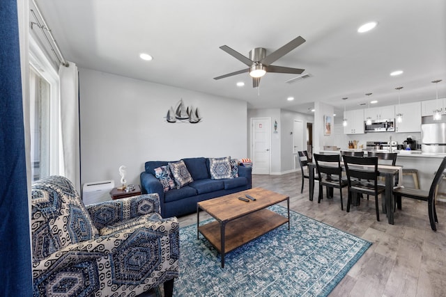 7600 Seawall Blvd Unit 214, Galveston, TX 77551 - living room with ceiling fan, recessed lighting, and light wood-style floors