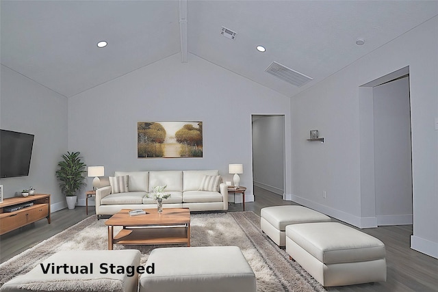living area with wood finished floors, baseboards, beamed ceiling, and visible vents